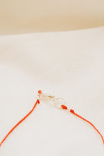 Minimalist spiritual talisman bracelet in silver and red string
