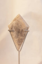 Adularescent moonstone on display stand