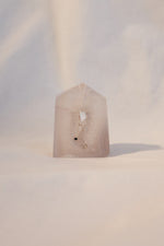 Polished agate geode point on shelf