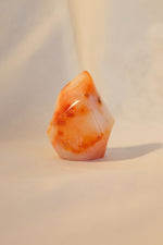 Vibrant carnelian point for focus and energy
