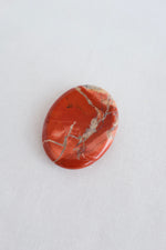 Root chakra crystal palm stone