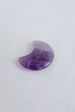 Third eye chakra crystal shaped like a moon