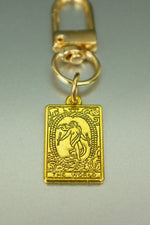 The World Gold Tarot Card Bag Charm • Clip-On Completion Talisman