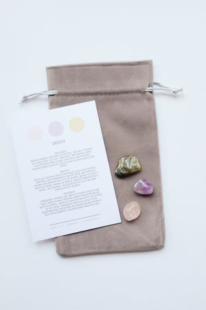 Packet of crystals for anxiety, containing soothing stones to help reduce stress and promote a sense of calm.