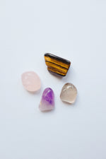 Packet of crystals for bereavement, including various healing stones designed to provide comfort and support during times of loss.