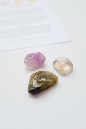 Packet of crystals for home protection, featuring stones known for their protective and grounding properties to safeguard your living space.