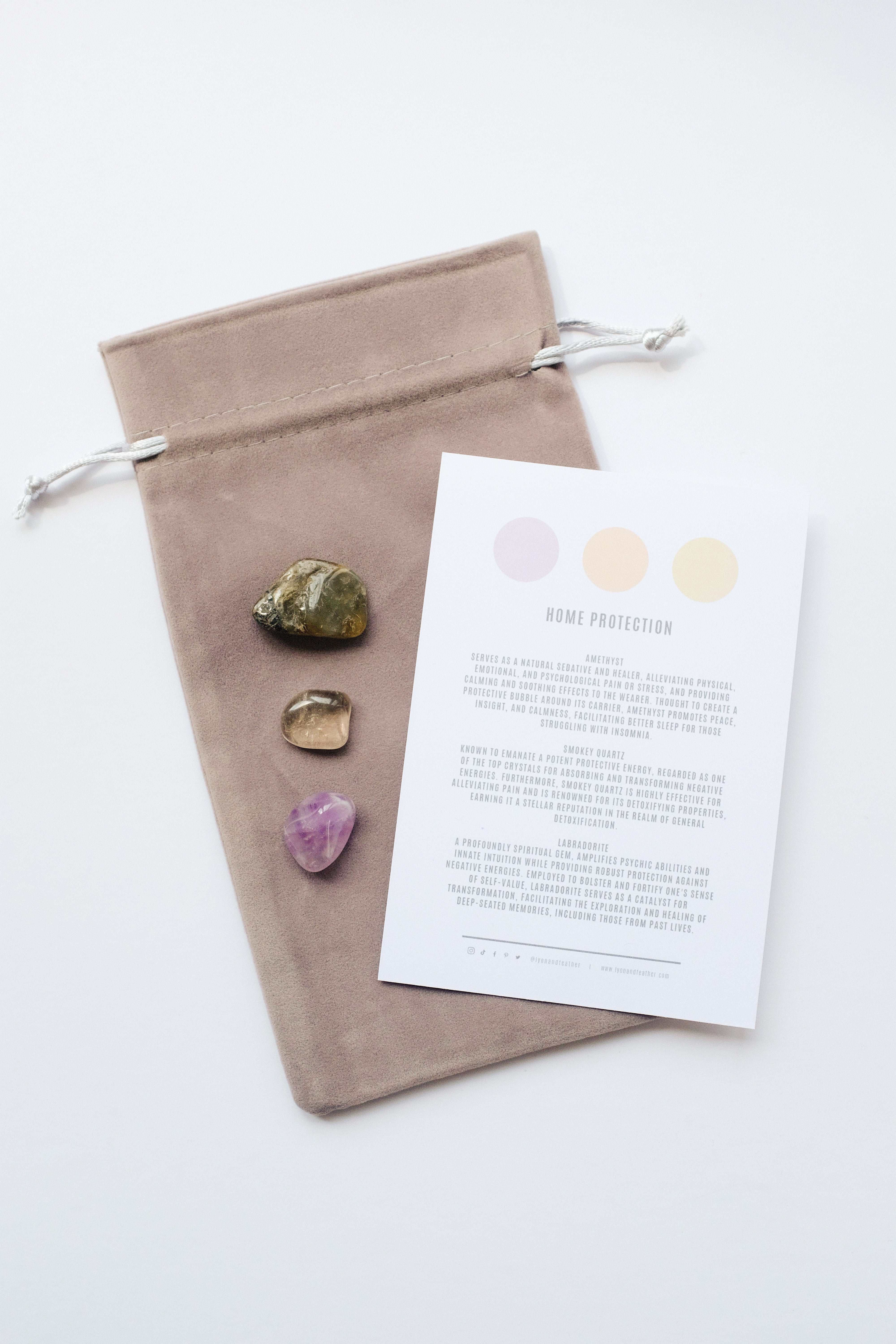 Packet of crystals for home protection, featuring stones known for their protective and grounding properties to safeguard your living space.